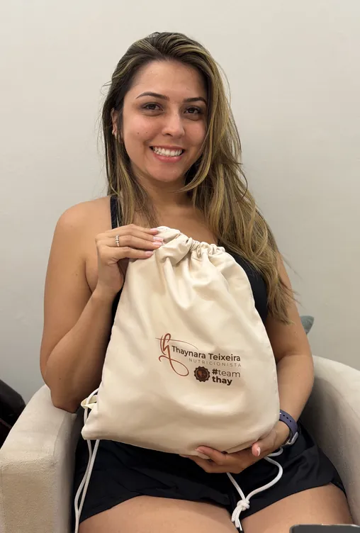 Paciente com a mochilinha NutriTransforma